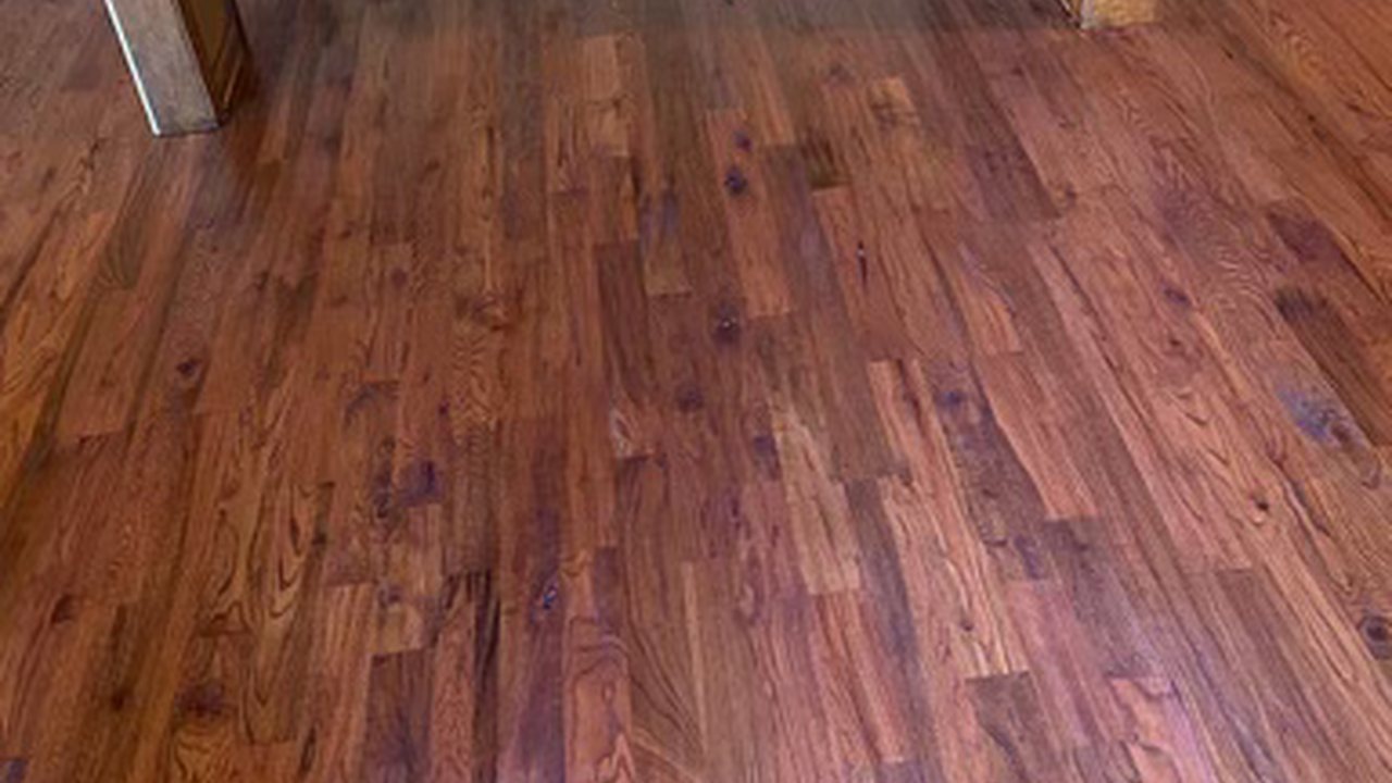 Richly refinished hardwood floor after TRC interior work