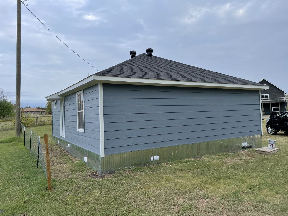 Home with new lap siding installed by Texas Roofing & Construction