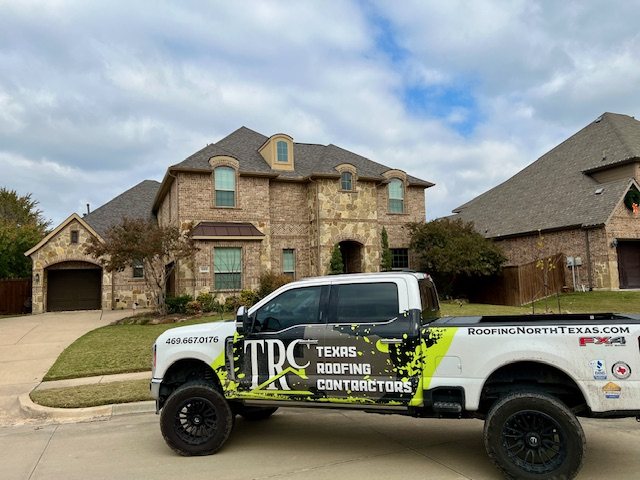 Texas Roofing & Construction branded truck at a North Texas home